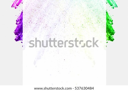 abstract Explosion of colored powder on white background ,Freeze motion of color powder exploding/throwing color powder, multicolored glitter texture.