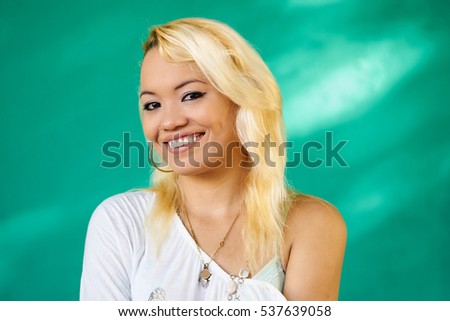 Cuban people and emotions, portrait of beautiful latina girl laughing and looking at camera. Happy hispanic young woman from Havana, Cuba smiling