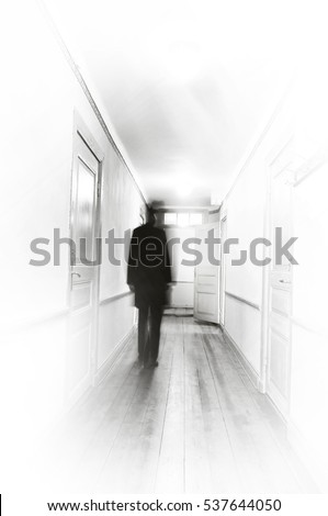 Man in black, motion blur, walking in a white hospital corridor. Royalty-Free Stock Photo #537644050
