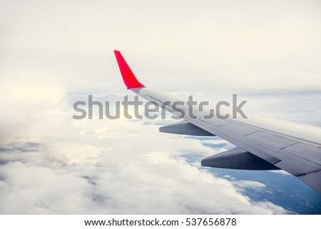 Morning cloudy sunrise with Wing of an airplane. picture for add text message or frame website. Traveling concept