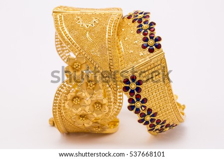 Beautiful gold bangle isolated on white background.  Royalty-Free Stock Photo #537668101
