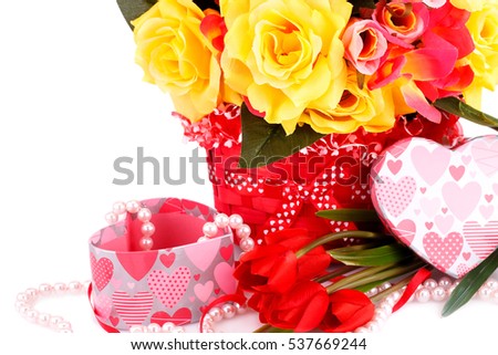 Colorful flowers, beads and gift box close up picture.
