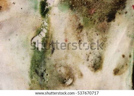 Textures of green mold on wet cloth.