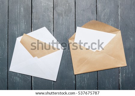 Photo of blank envelope on a  wooden background