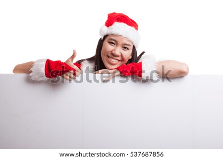 Asian Christmas Santa Claus girl  thumbs up with blank sign  isolated on white background.