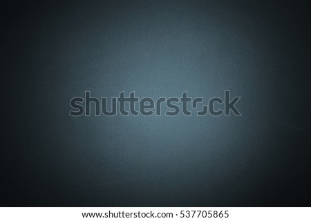 Cyan colour paper with texture useful as a background vignetted and gradient background