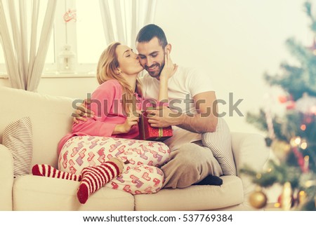 Couple in love with Christmas present