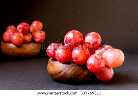 Red Grape Bunch on black ground
