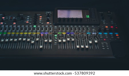 The audio equipment, control panel of digital studio mixer, front view. Close-up, selected focus Royalty-Free Stock Photo #537809392