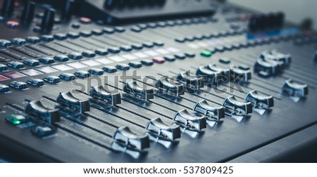 The audio equipment, control panel of digital studio mixer, side view. Close-up, selected focus Royalty-Free Stock Photo #537809425