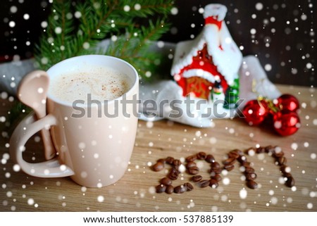 Christmas and New Year 2017 background and cup of cappuccino with cinnamon