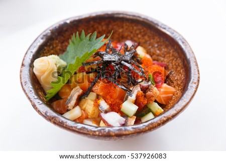 Mixed Donburi : Diced Salmon, Tentacle Squid, Maguro, Unagi, Cucumber with Ebiko and Seaweed Topping on Japanese Steamed Rice that Served with Prickled Ginger and Miso Soup. 