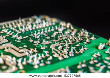 Close up of old circuit board with electronic components