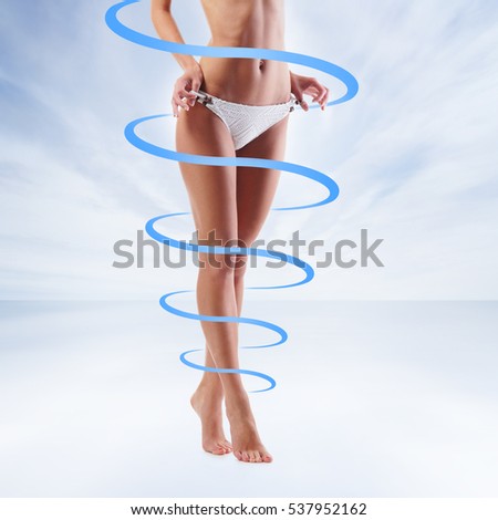 Close-up of thin and beautiful female body. Weight loss, sports, exercising, water balance, healthy nutrition concept. Blue arrows.