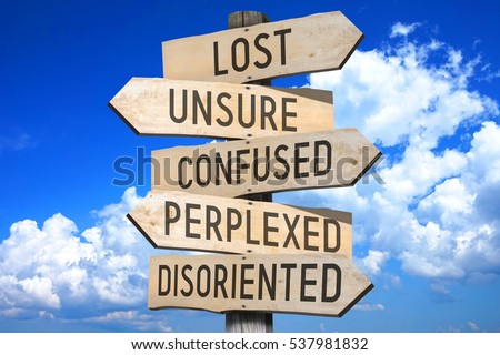 Wooden signpost - lost concept (lost, unsure, confused, perplexed, disoriented). Royalty-Free Stock Photo #537981832
