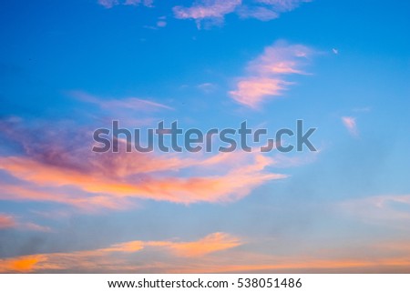 orange clouds in the blue sky background