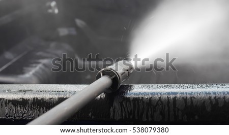 spraying pressure washer for car wash Royalty-Free Stock Photo #538079380