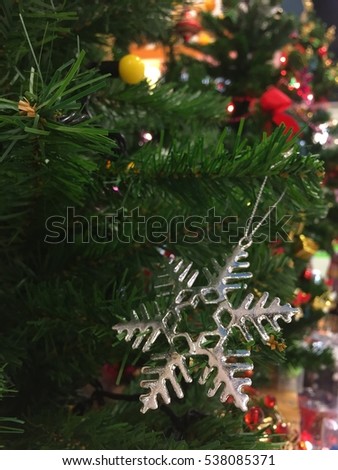 Close up decor ice shape toy on Christmas tree  for cerebrate happy season