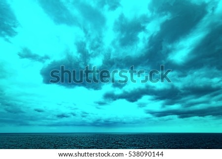 Atlantic Ocean with dramatic colorful sky and clouds. Cruising along Islands, view from cruise ship, image with color filter effect for tourism business concept, travel blogs, creative photo website