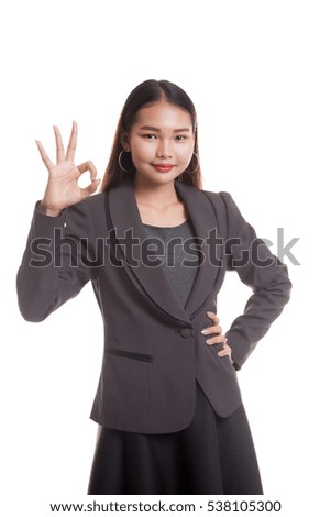 Young Asian business woman show OK sign  isolated on white background.