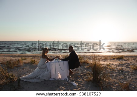 Beautiful stylish cheerful young couple in the seaside wedding day, high-quality color photos, wedding day, summer