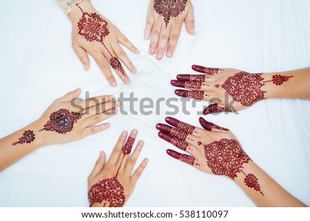 several henna design on hands Royalty-Free Stock Photo #538110097