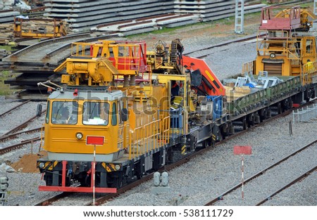 Repair train. Diesel rail car on the siding railway track