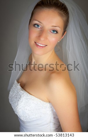 Bride woman in wedding dress in studio