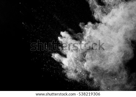 abstract splashes of powder on a black background