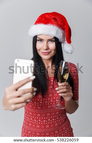 Brunette in Christmas photographing herselves