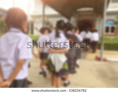 Blur kids and teacher in the school for background usage.
