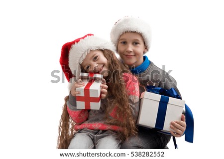 little children in costume holding boxes with gifts. New Year. Merry Christmas