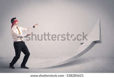 A scared blindfolded businessman forced to face a problem concept with illustrated arrow pointng to the sky in empty space.