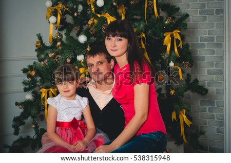 Happy family on the eve of New Year and Christmas
