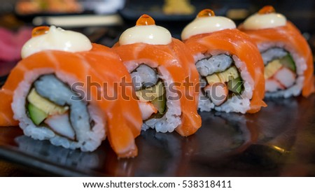 Sushi rolls fish caviar salmon rice avocado wasabi tuna.(Selective focus)