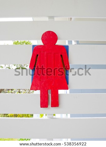 Women toilet sign on wooden wall