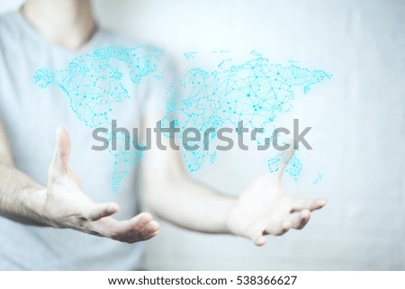 businessman holding world map in hands