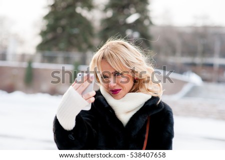 Beautiful girl winter selfie, blonde, outdoors