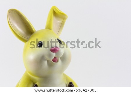 Rabbit statue holding a white banner.