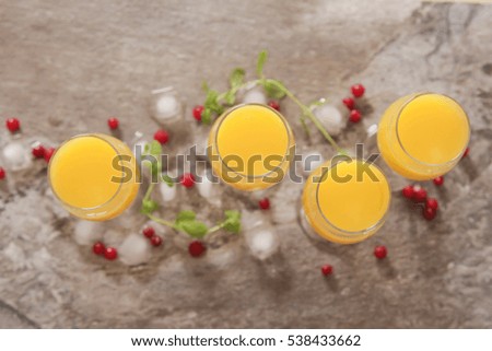 tasty cocktail with juice. a party at the bar on a gray background