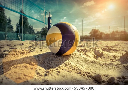 Beach Volleyball. Game ball under sunlight and blue sky. Royalty-Free Stock Photo #538457080