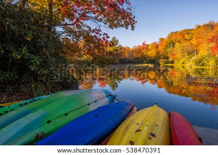 Beached kayaks and autumn color at Price Lake along the Blue Ridge Parkway in North Carolina