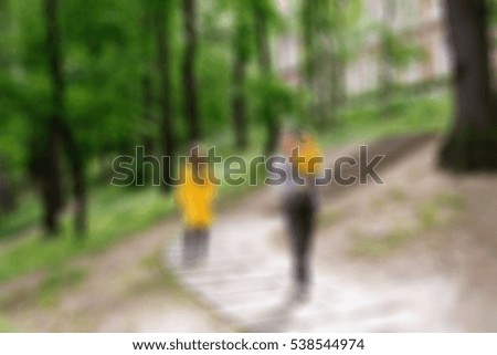 Happy family on a walk theme creative abstract blur background with bokeh effect