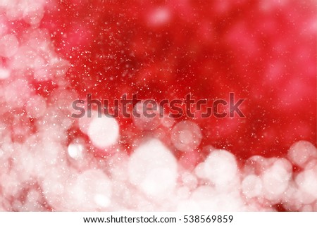 Red Christmas Background with snow circle glitter or bokeh lights. Round gold defocused particles