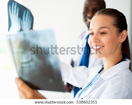 Female doctor looking at the x ray picture