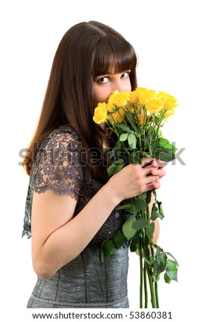Young woman holding the bunch of yellow roses, isolated on white background