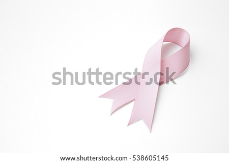 Pink awareness ribbon with trail on white background