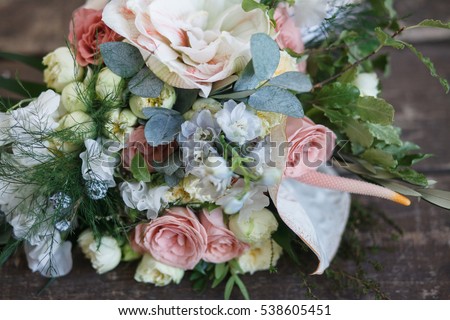 Bridal bouquet. The bride's bouquet. Beautiful bouquet of white, blue, pink flowers and greenery