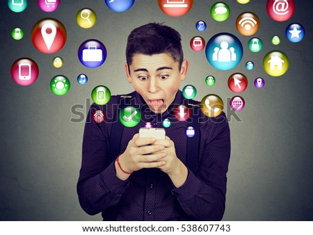 Communication technology mobile phone high tech concept. Shocked man using texting on smartphone application icons flying out of cellphone screen. Face expressions emotions 