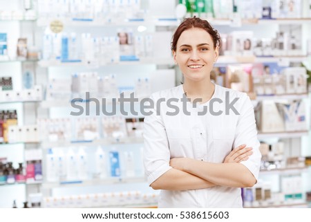Something for each client. Portrait of a cheerful female pharmacist smiling to the camera with her arms crossed copyspace 